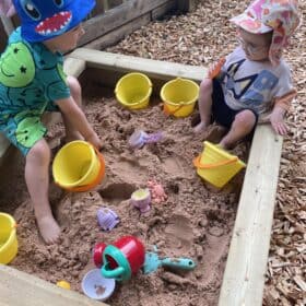 Sandpit playtime in Tiny Tree Leeds outdoor area